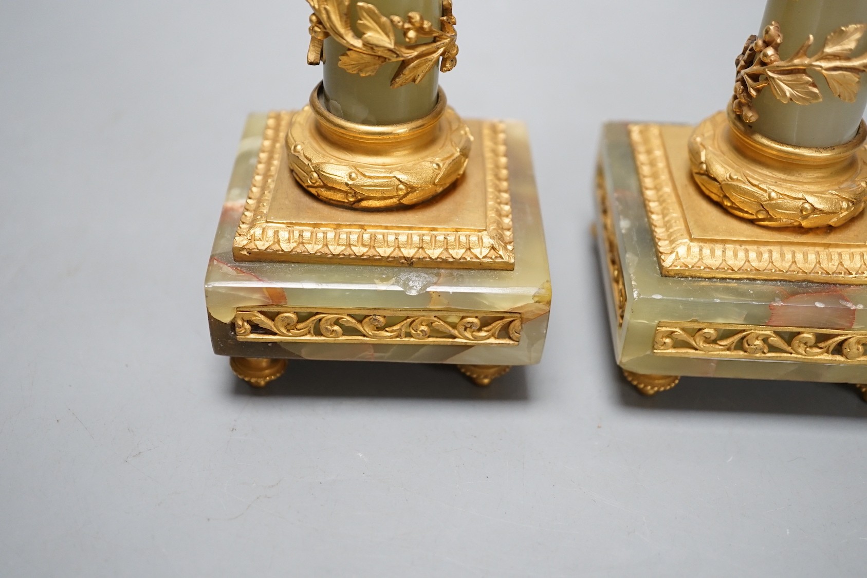 A pair of neoclassical revival green onyx and ormolu candlesticks, c.1900 - 20cm tall
